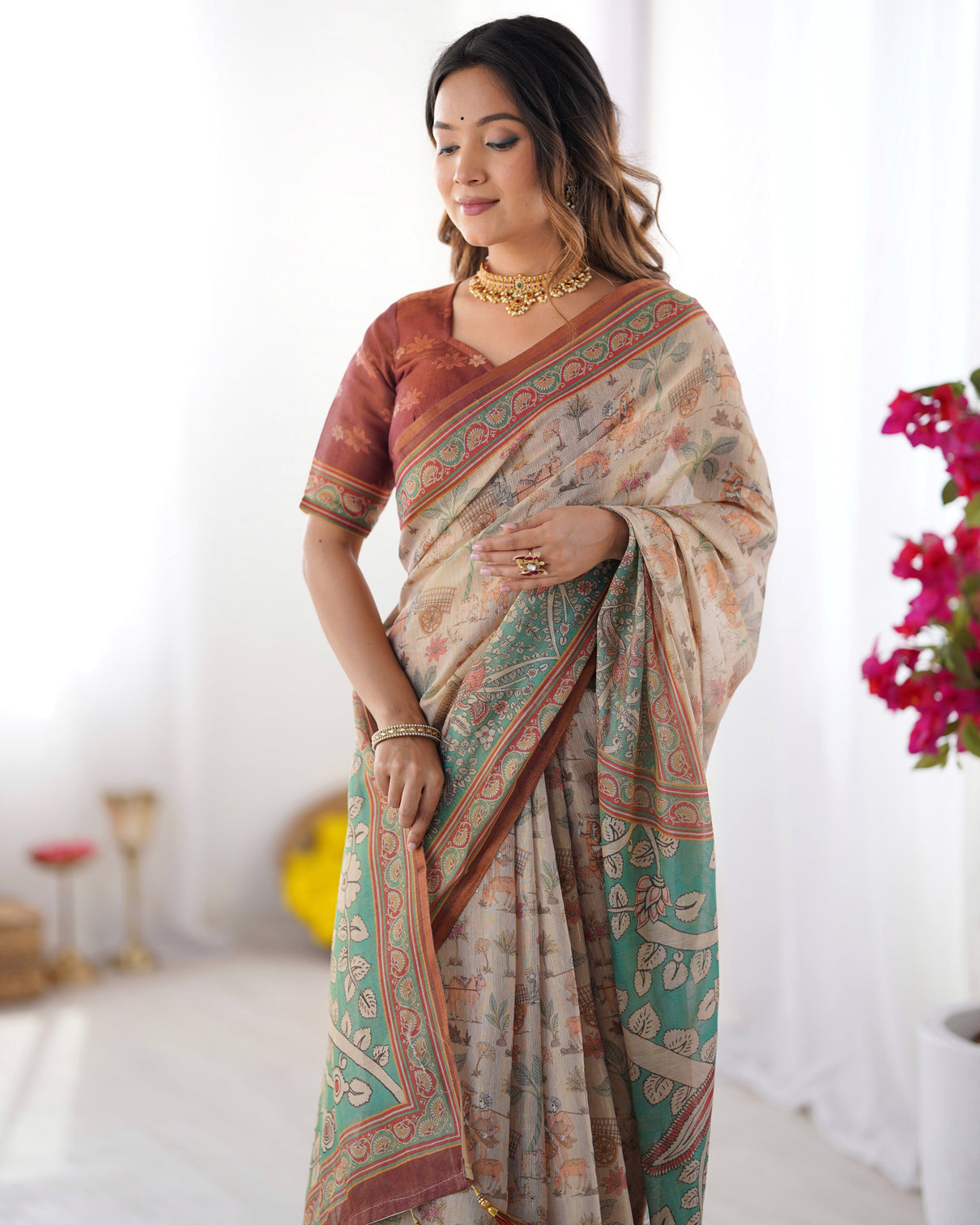 Beige green handloom cotton saree with village life print and majestic peacock pallu