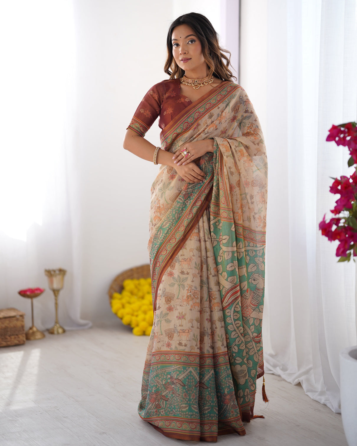 Beige green handloom cotton saree with village life print and majestic peacock pallu