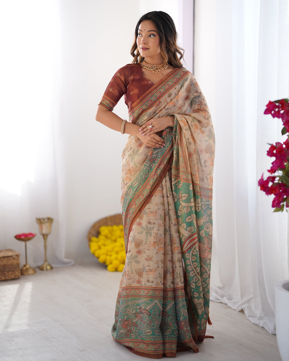 Beige green handloom cotton saree with village life print and majestic peacock pallu