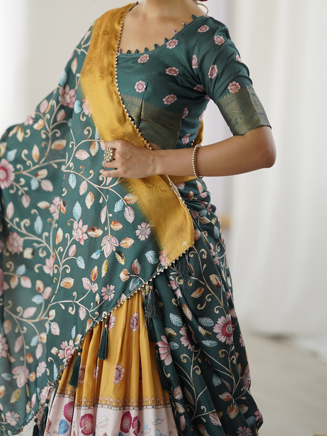 Bottle green kalamkari flared lehenga with mustard dupatta