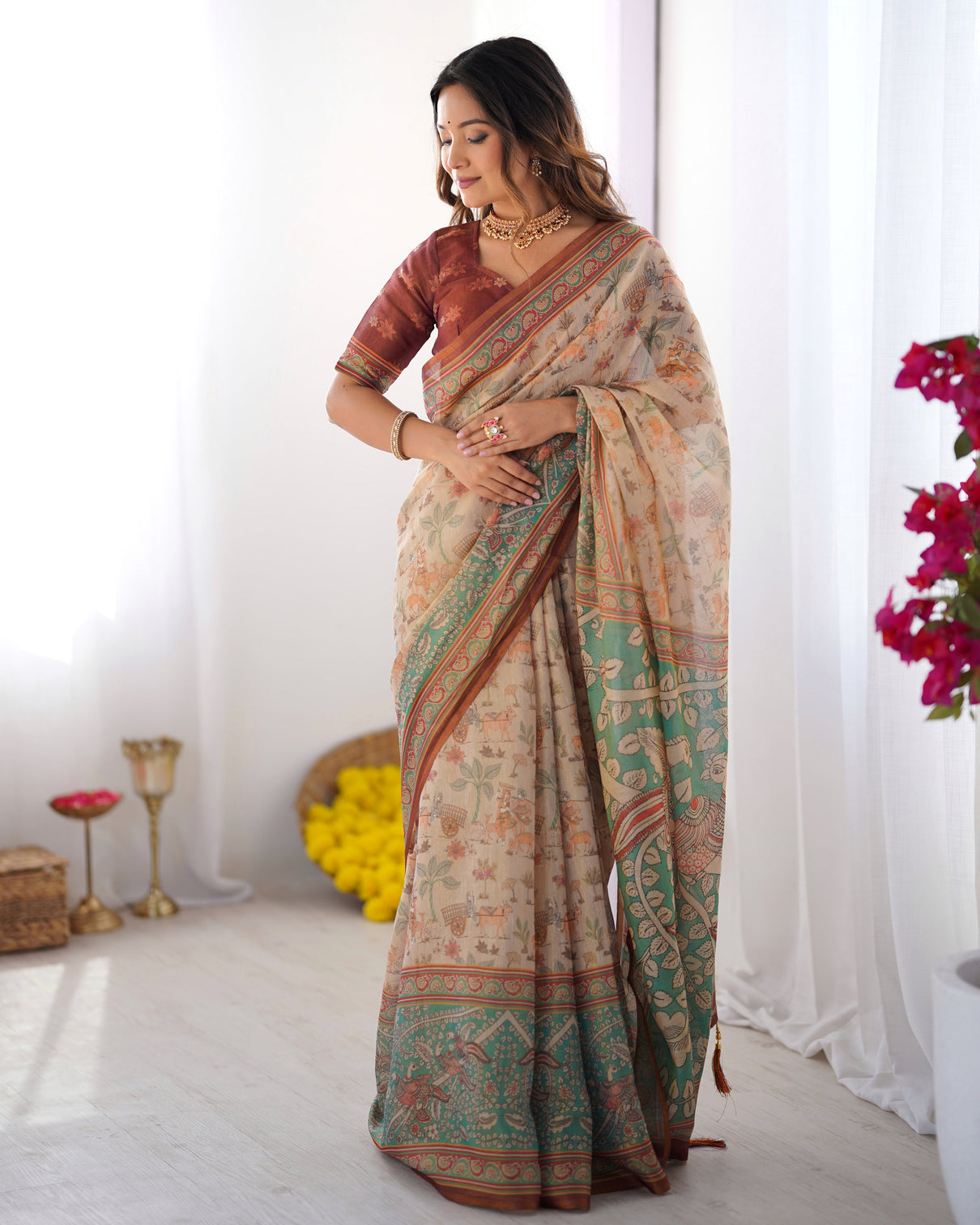 Beige green handloom cotton saree with village life print and majestic peacock pallu
