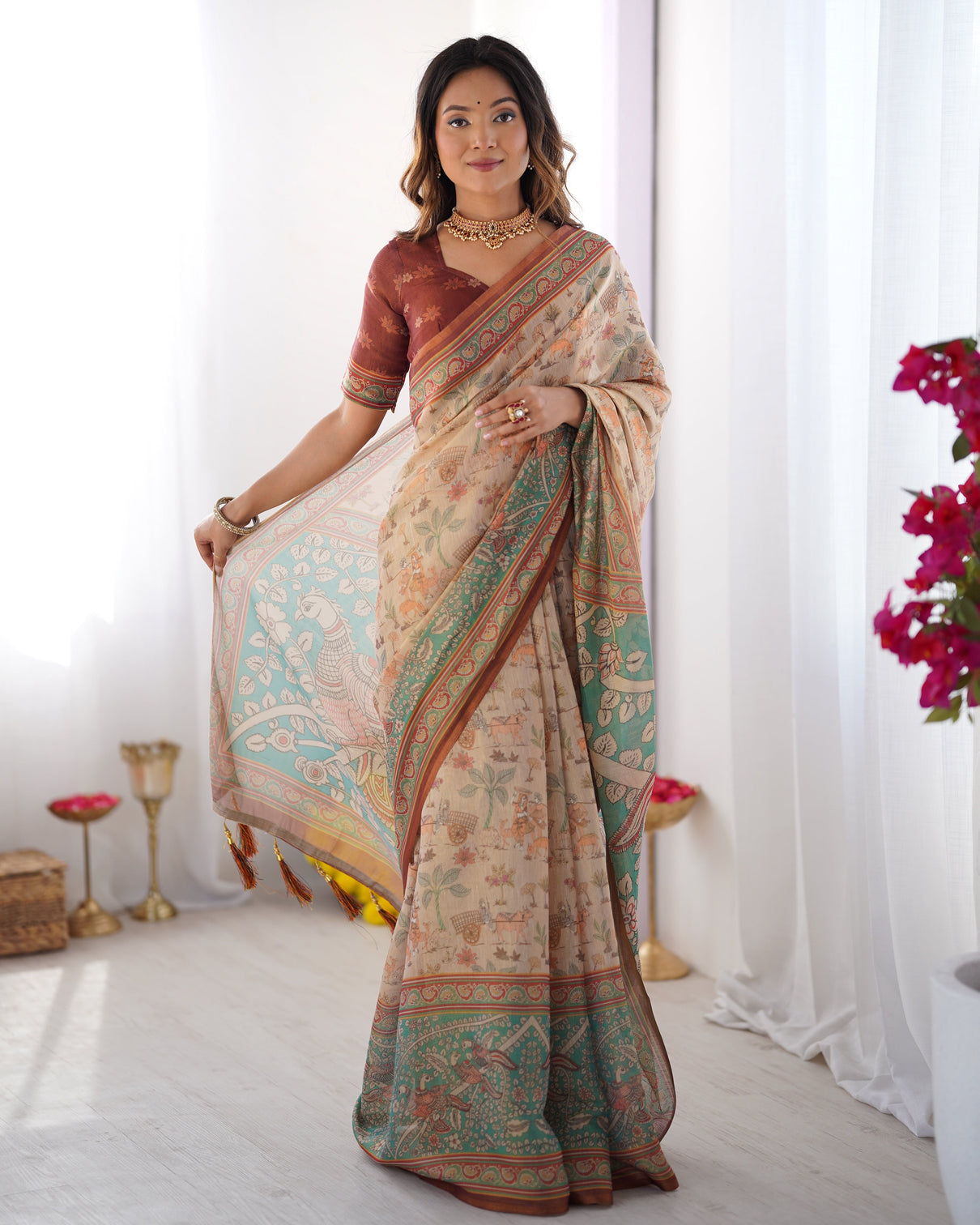Beige green handloom cotton saree with village life print and majestic peacock pallu