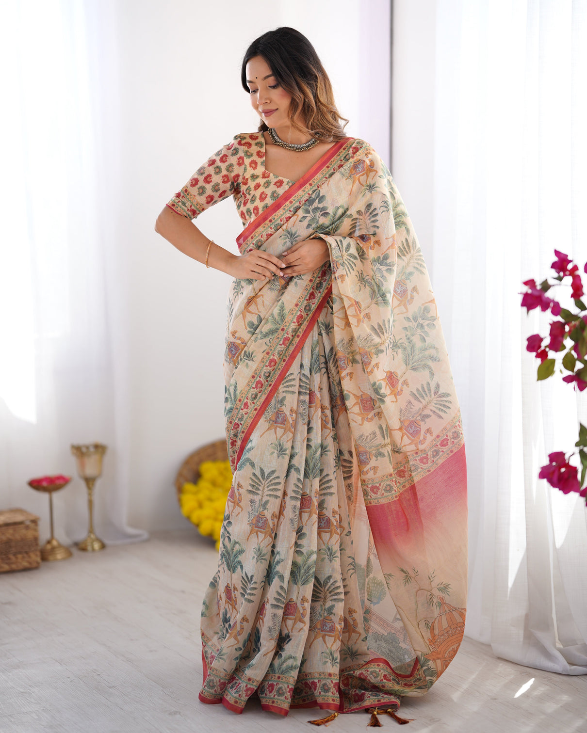 Beige red handloom linen cotton saree with camel caravan palace artwork