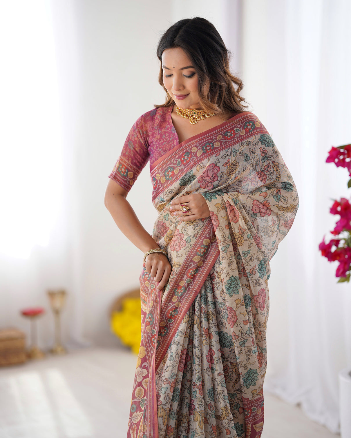 Cream pink handloom cotton saree with pastel floral print and ornamental tree pallu