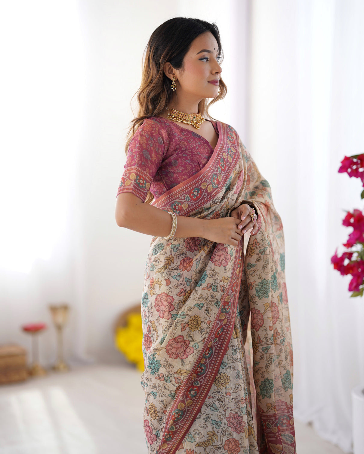 Cream pink handloom cotton saree with pastel floral print and ornamental tree pallu