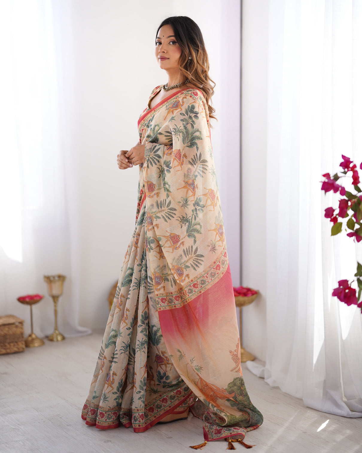 Beige red handloom linen cotton saree with camel caravan palace artwork