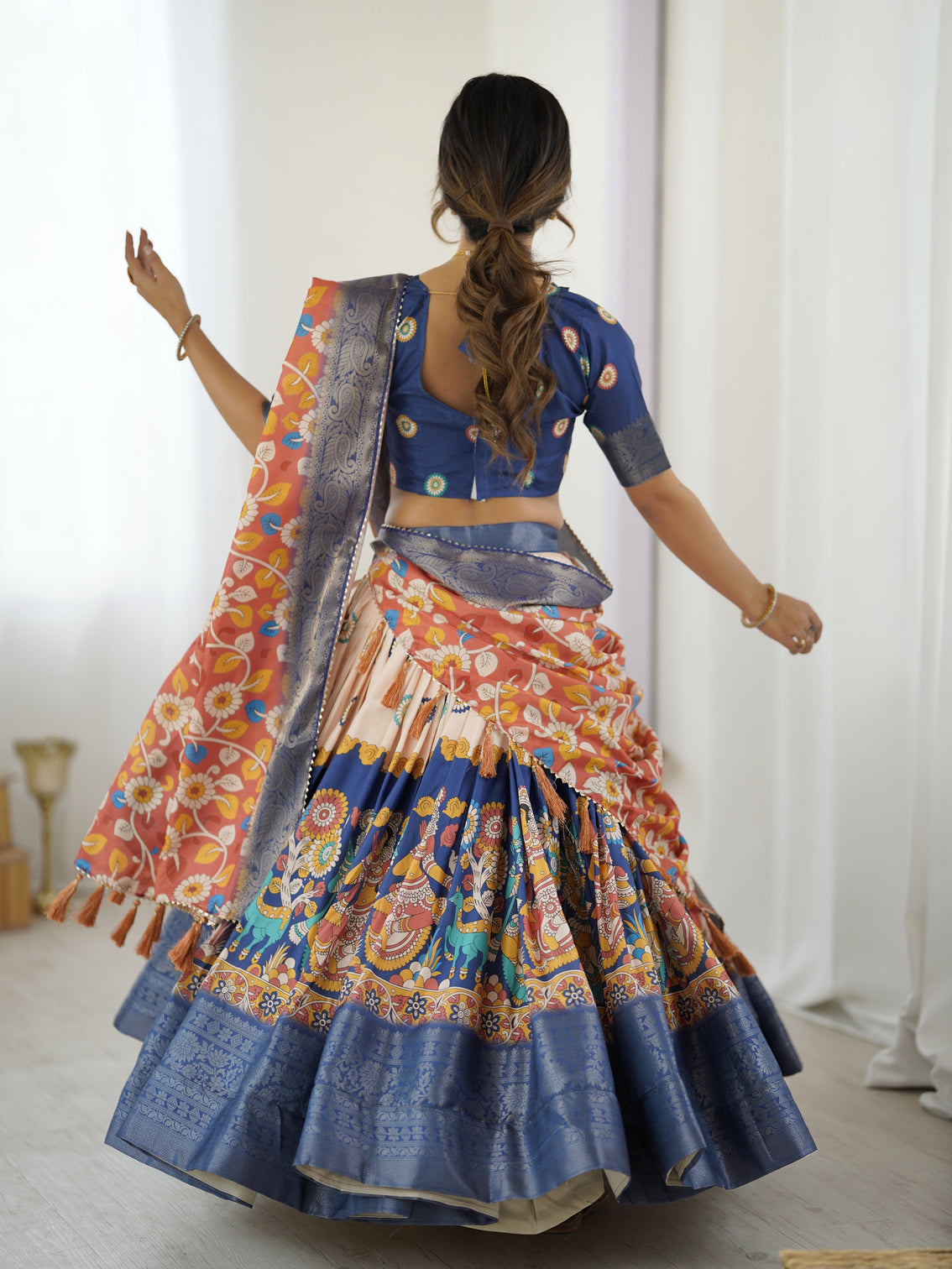 Royal blue peach kalamkari tussar silk lehenga with zari border floral tassel dupatta traditional festive wear