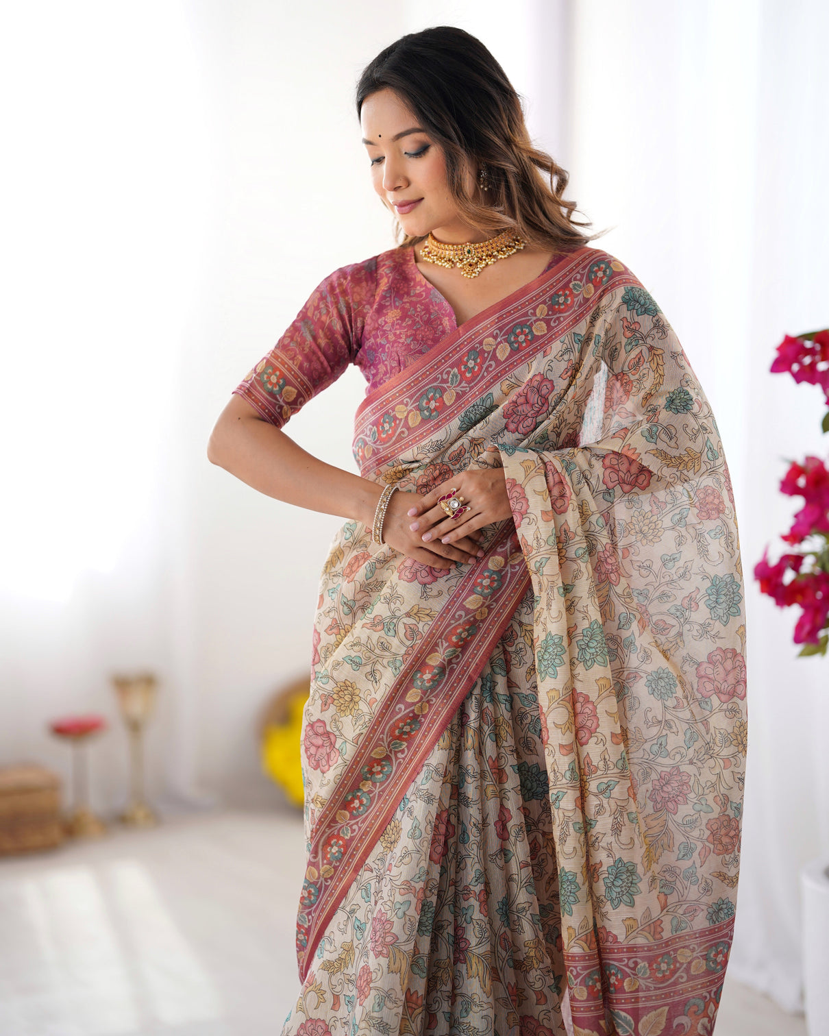 Cream pink handloom cotton saree with pastel floral print and ornamental tree pallu