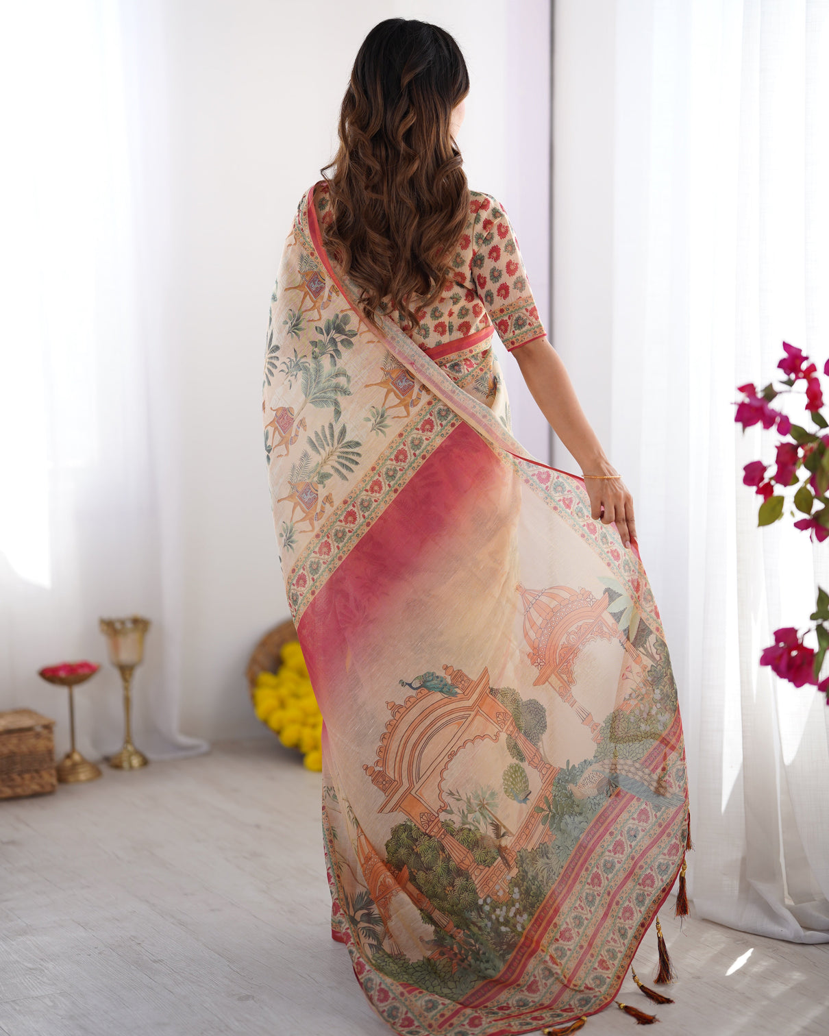 Beige red handloom linen cotton saree with camel caravan palace artwork