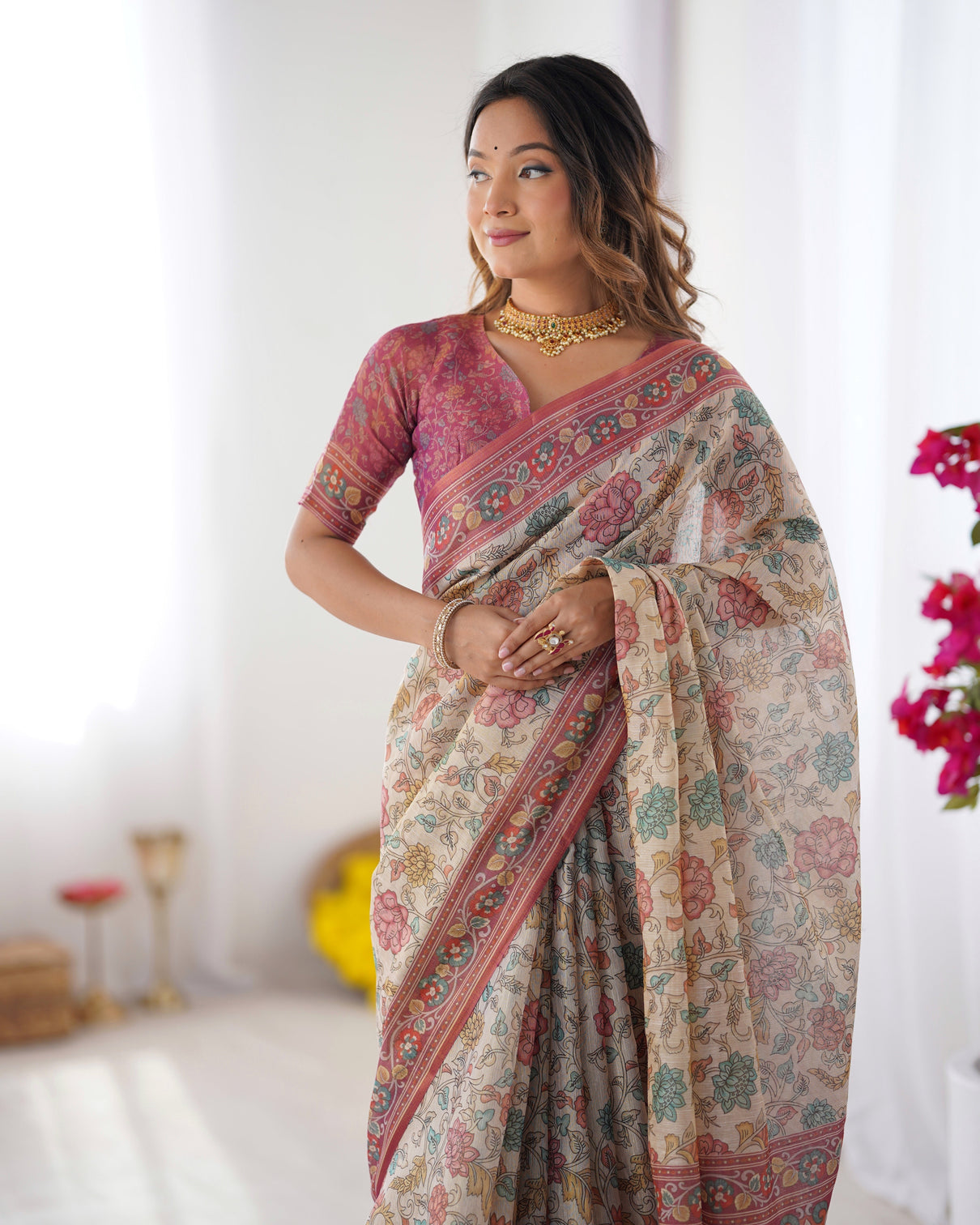 Cream pink handloom cotton saree with pastel floral print and ornamental tree pallu