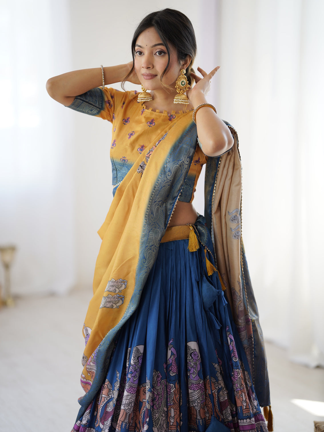 Elegant kalamkari lehenga in mustard and royal blue with flared skirt and dupatta