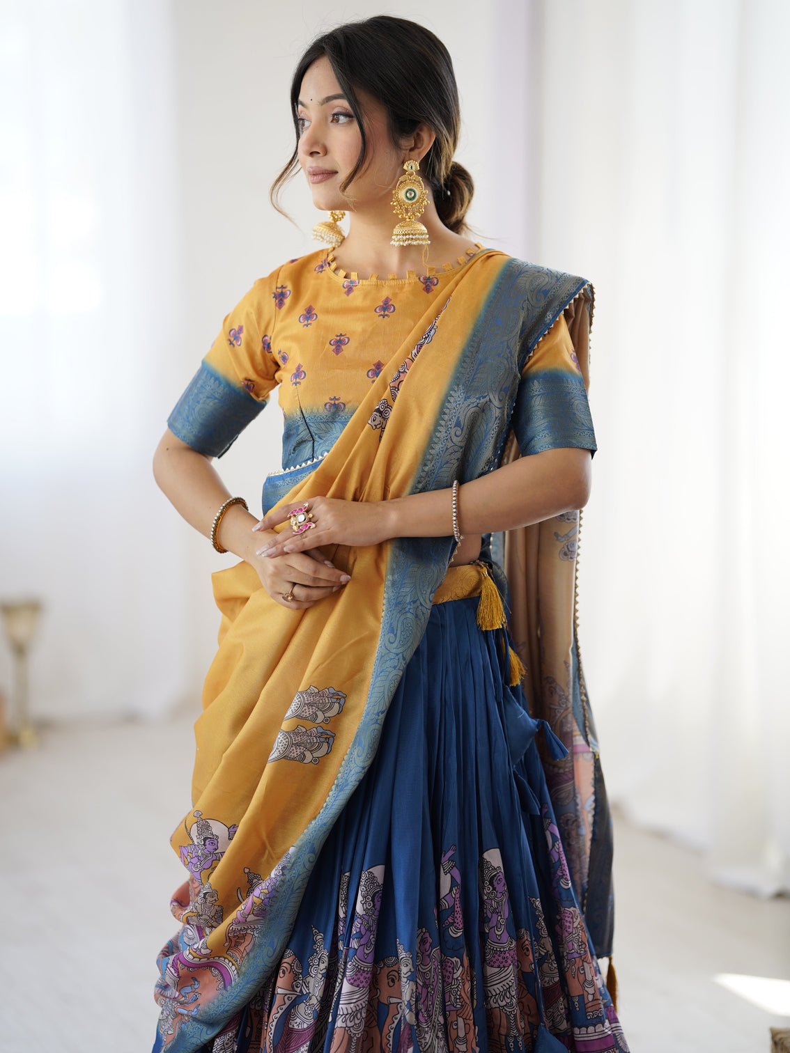 Elegant kalamkari lehenga in mustard and royal blue with flared skirt and dupatta