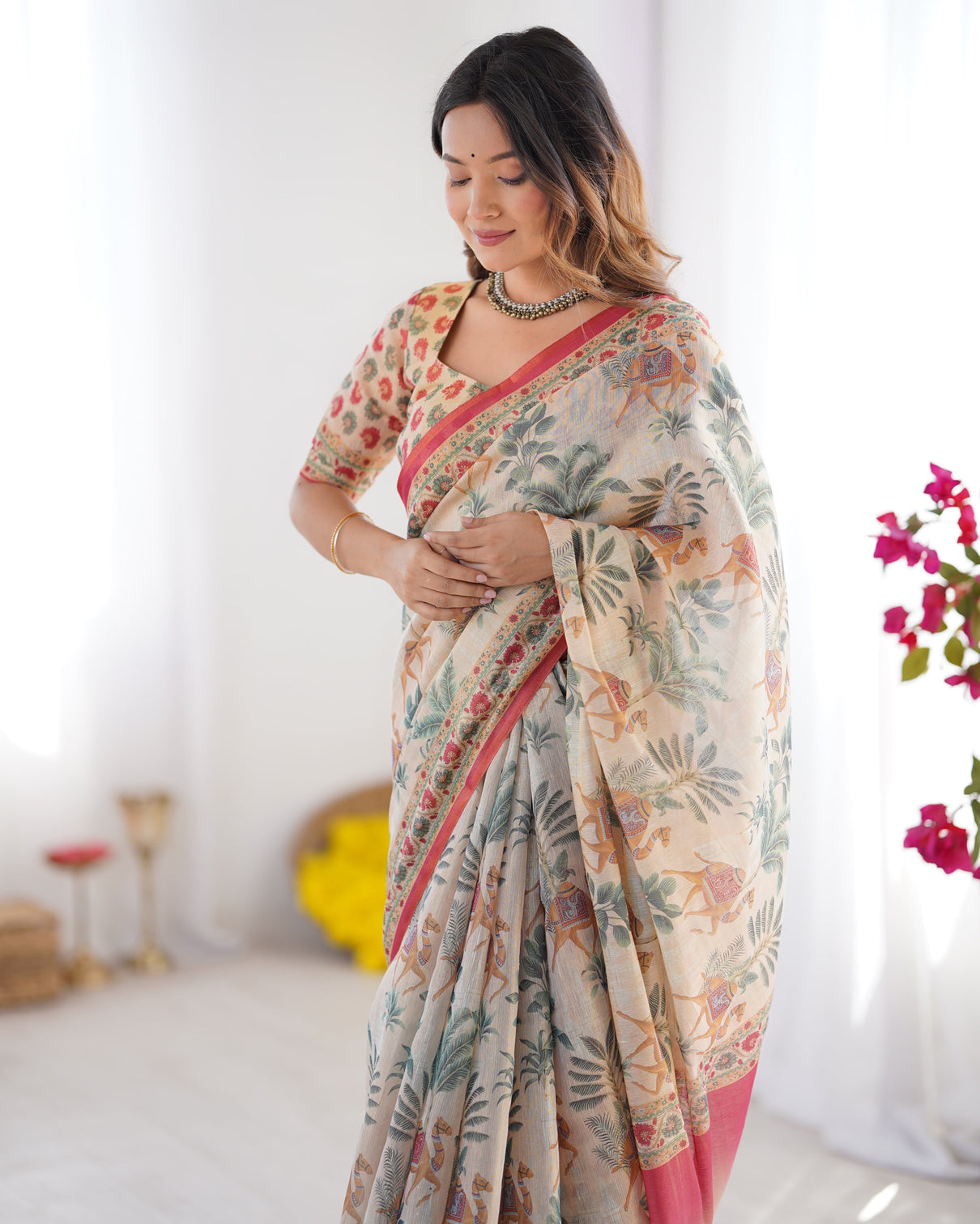Beige red handloom linen cotton saree with camel caravan palace artwork