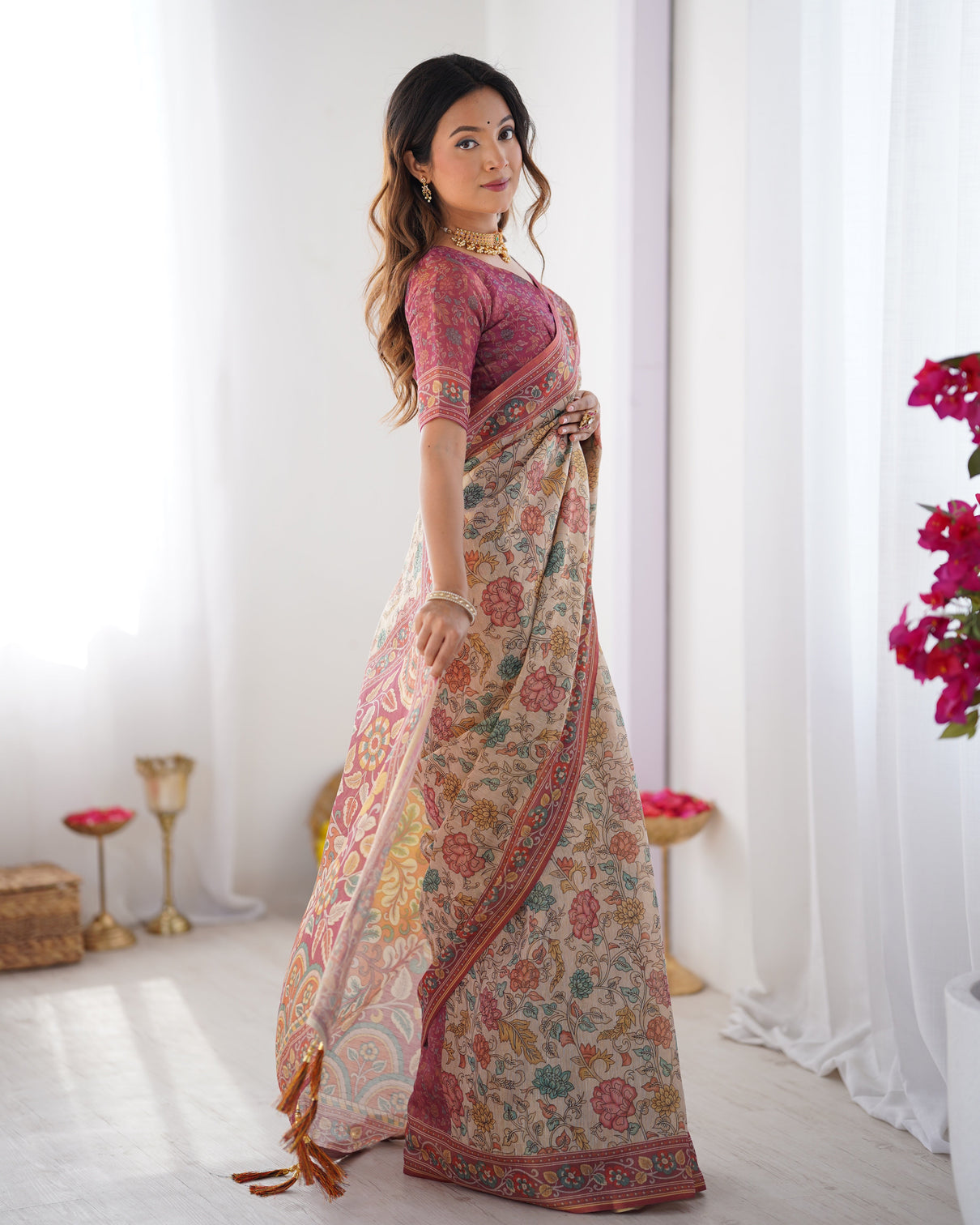 Cream pink handloom cotton saree with pastel floral print and ornamental tree pallu