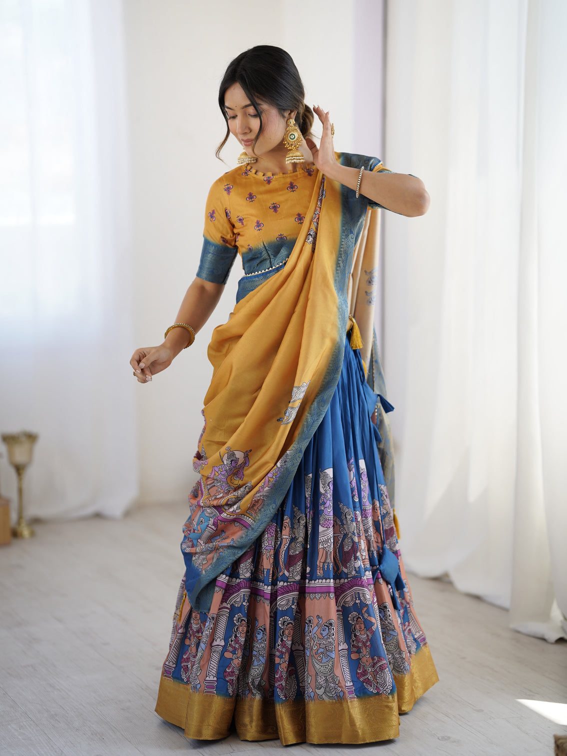 Elegant kalamkari lehenga in mustard and royal blue with flared skirt and dupatta