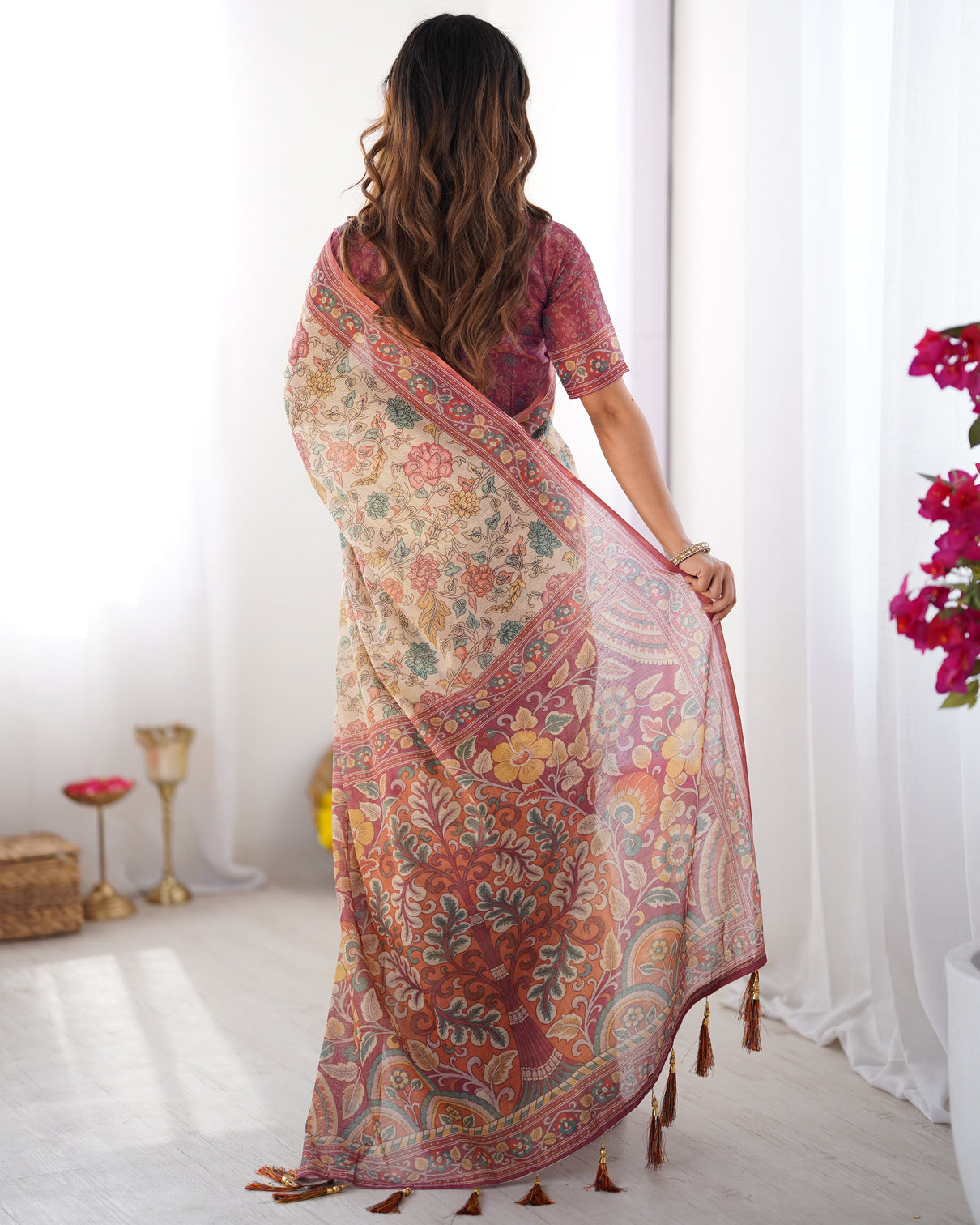 Cream pink handloom cotton saree with pastel floral print and ornamental tree pallu