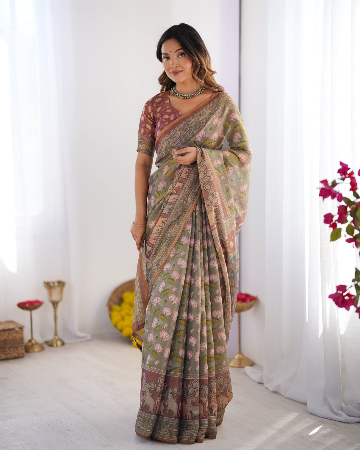 Olive green pure linen cotton handloom saree with pink lotus motifs maroon blouse