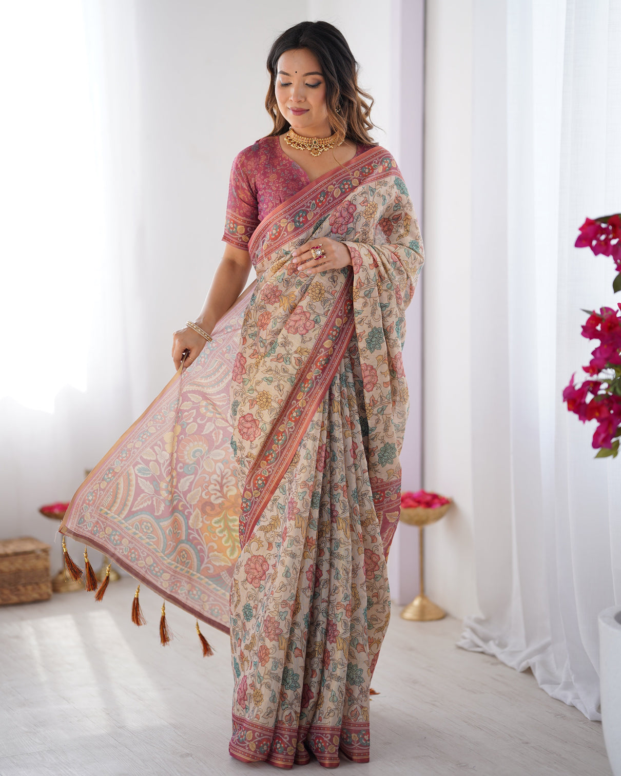 Cream pink handloom cotton saree with pastel floral print and ornamental tree pallu