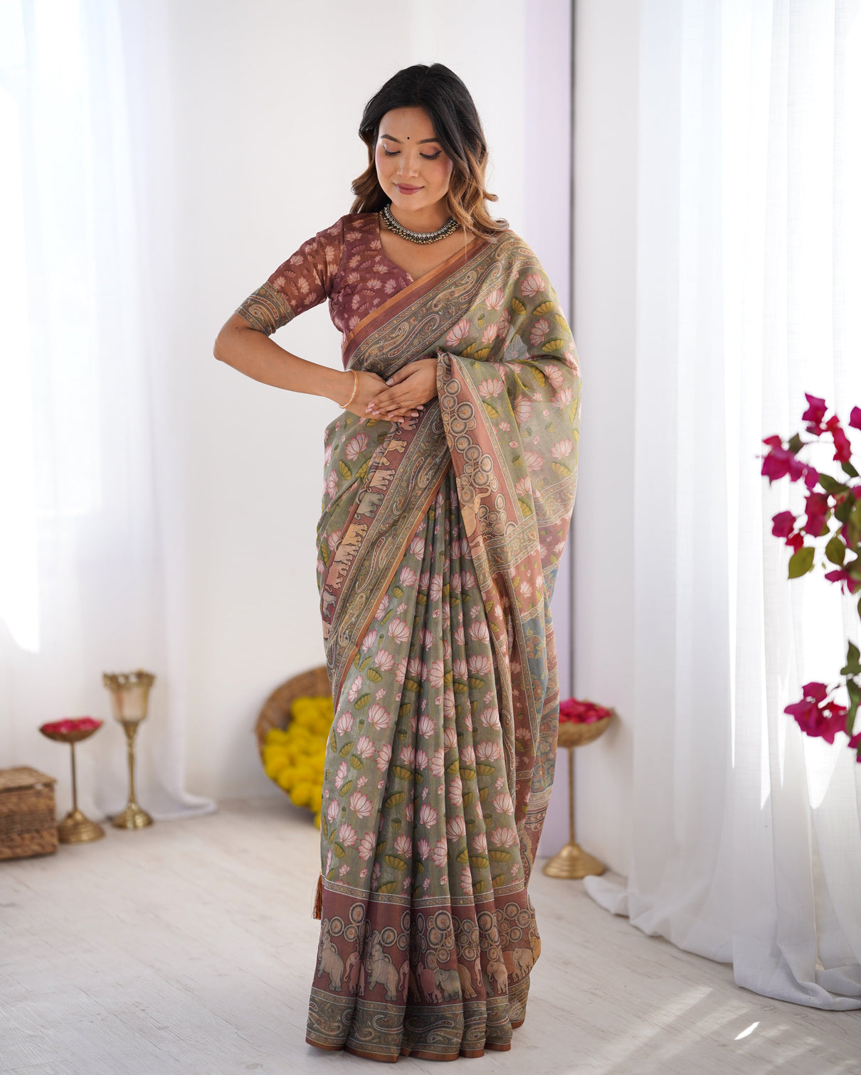 Olive green pure linen cotton handloom saree with pink lotus motifs maroon blouse