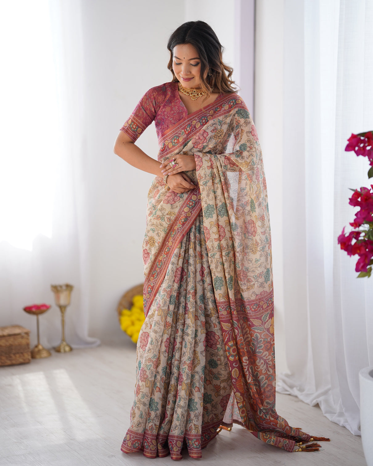 Cream pink handloom cotton saree with pastel floral print and ornamental tree pallu
