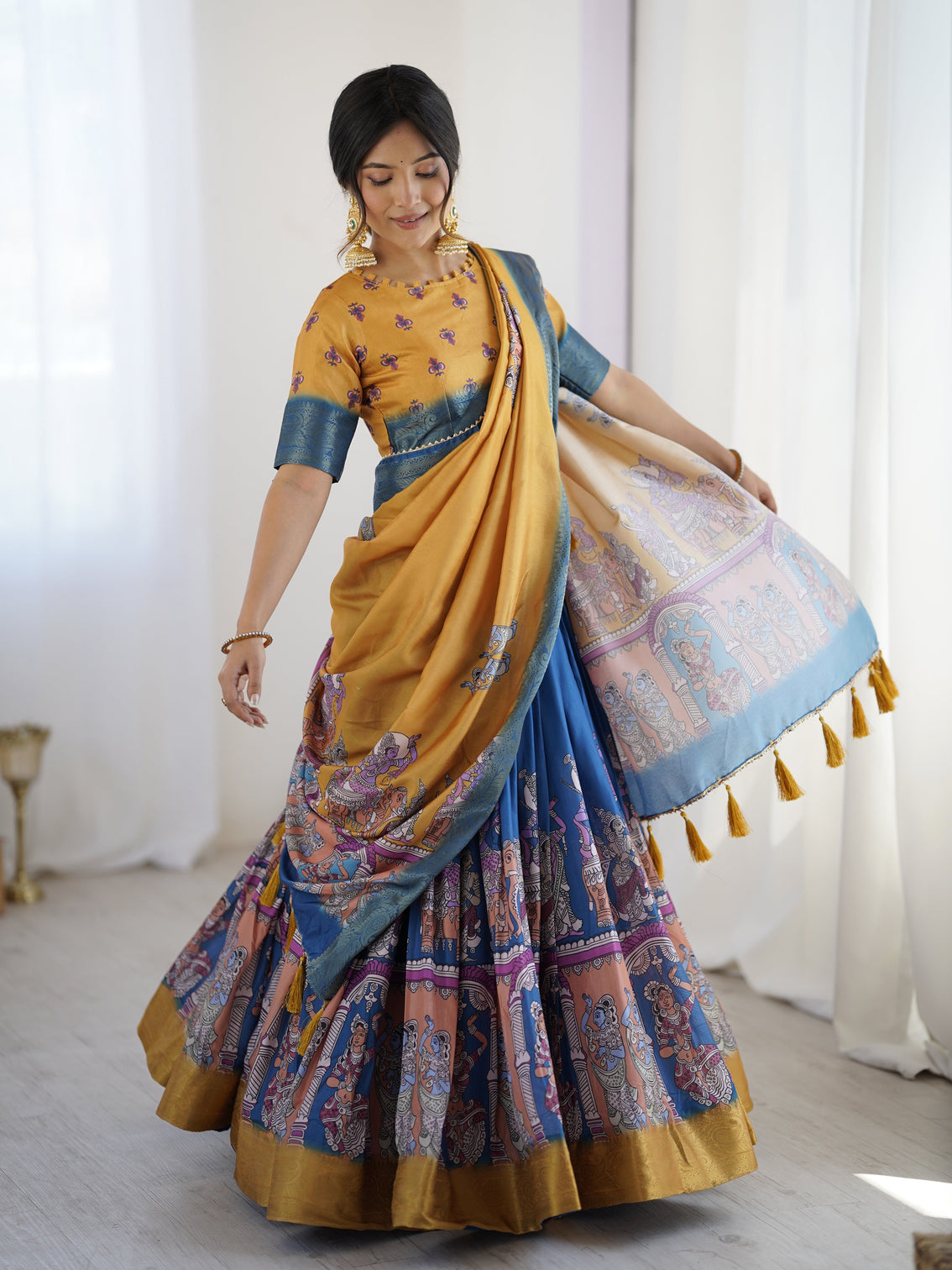 Elegant kalamkari lehenga in mustard and royal blue with flared skirt and dupatta