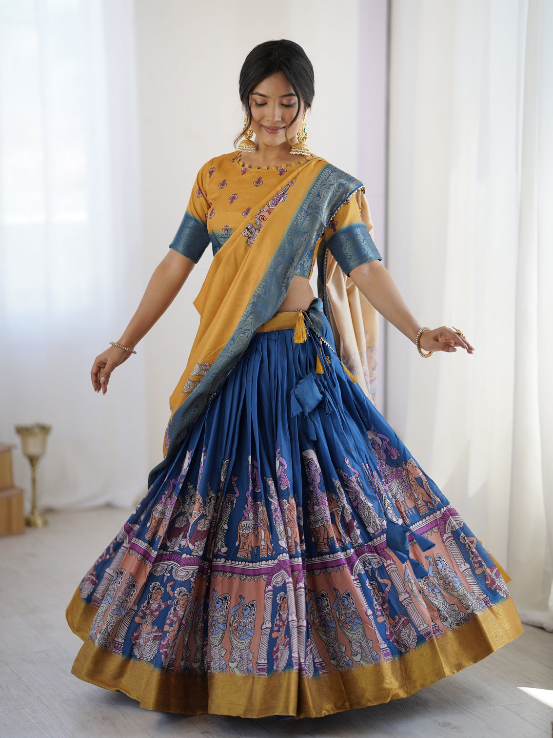 Elegant kalamkari lehenga in mustard and royal blue with flared skirt and dupatta