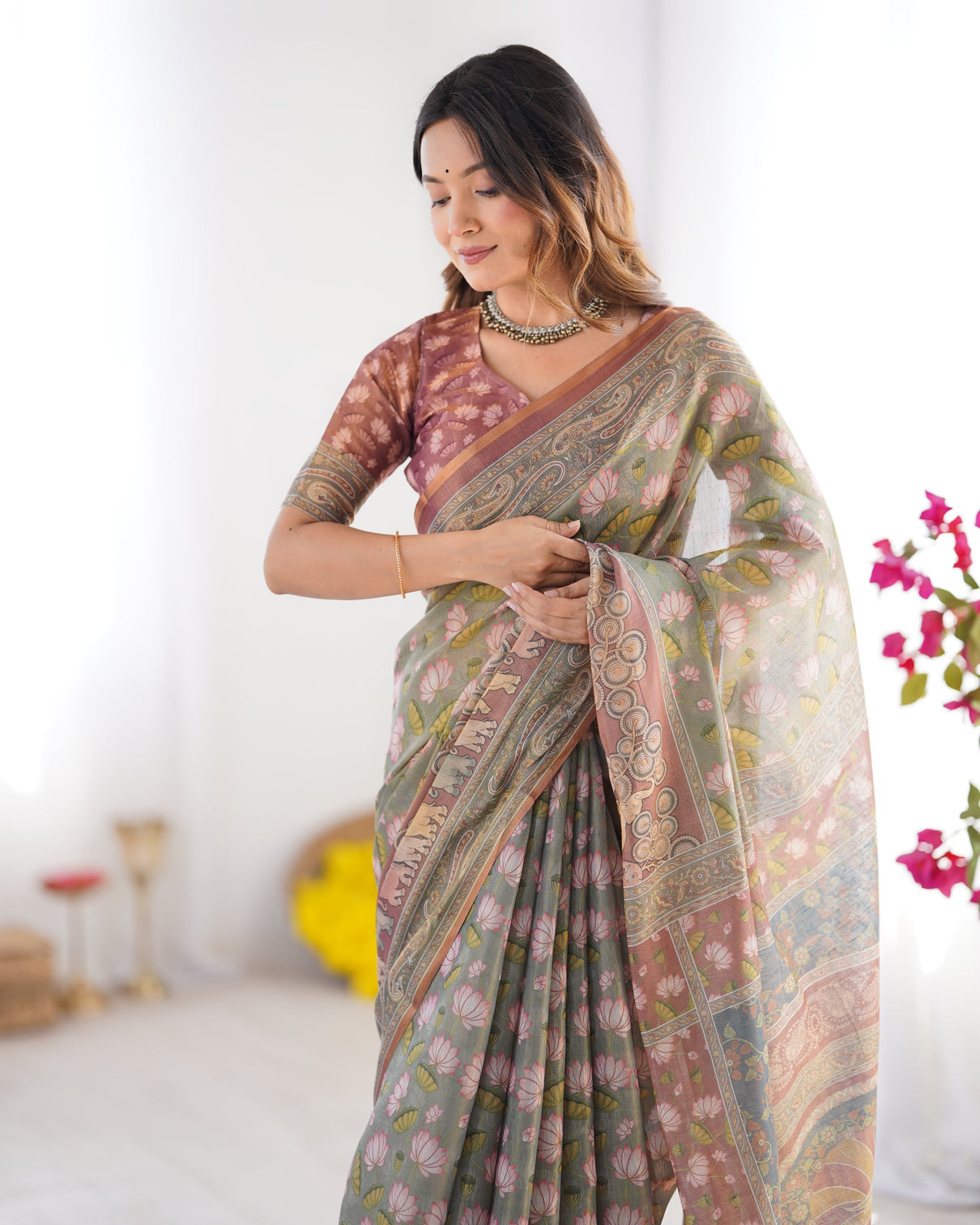 Olive green pure linen cotton handloom saree with pink lotus motifs maroon blouse