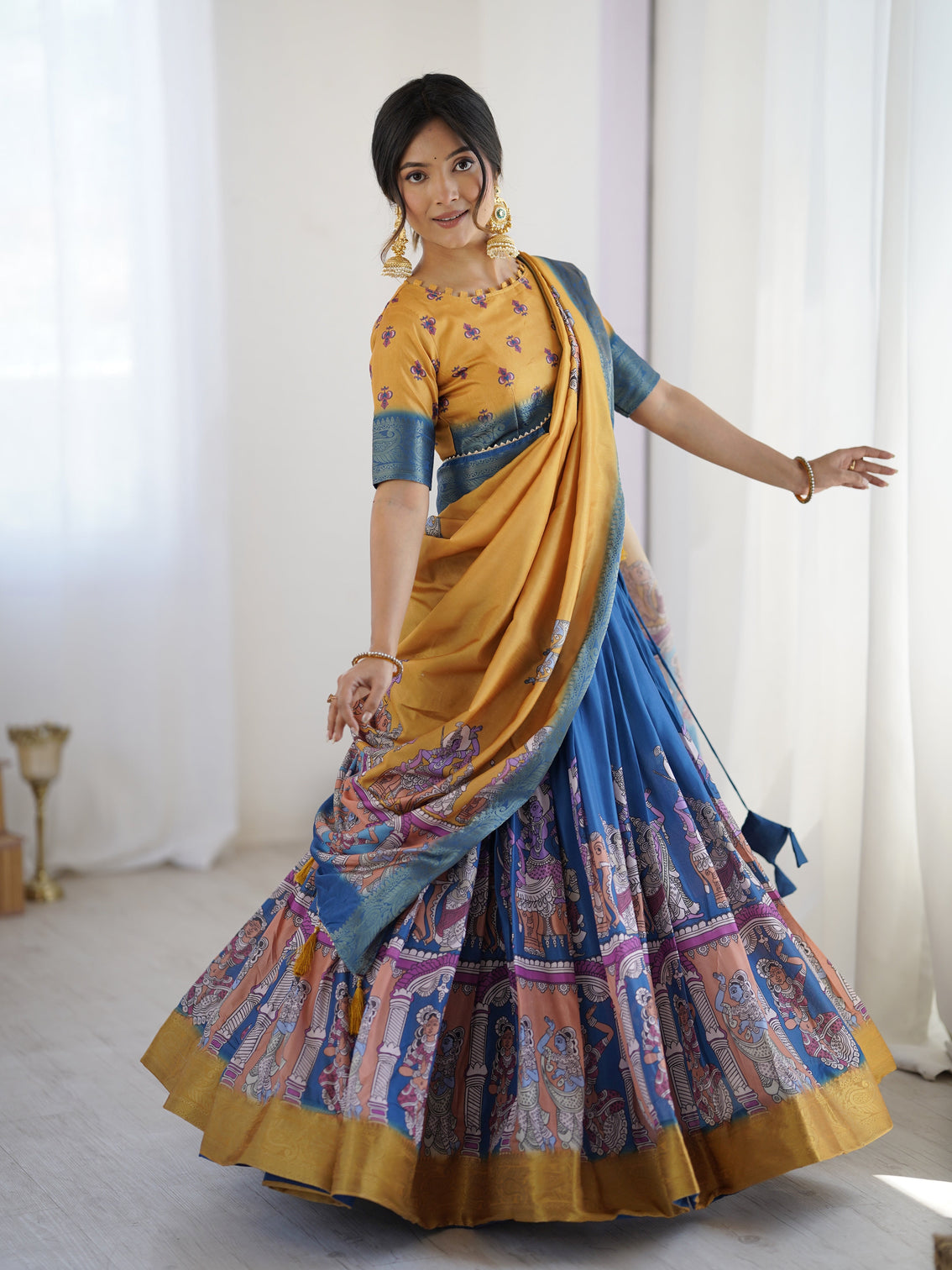 Elegant kalamkari lehenga in mustard and royal blue with flared skirt and dupatta