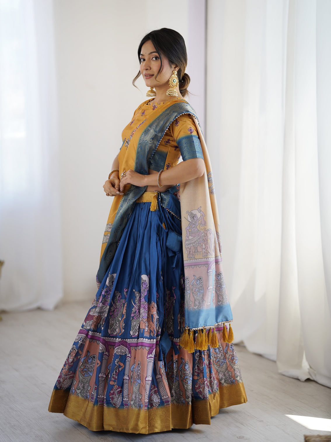 Elegant kalamkari lehenga in mustard and royal blue with flared skirt and dupatta