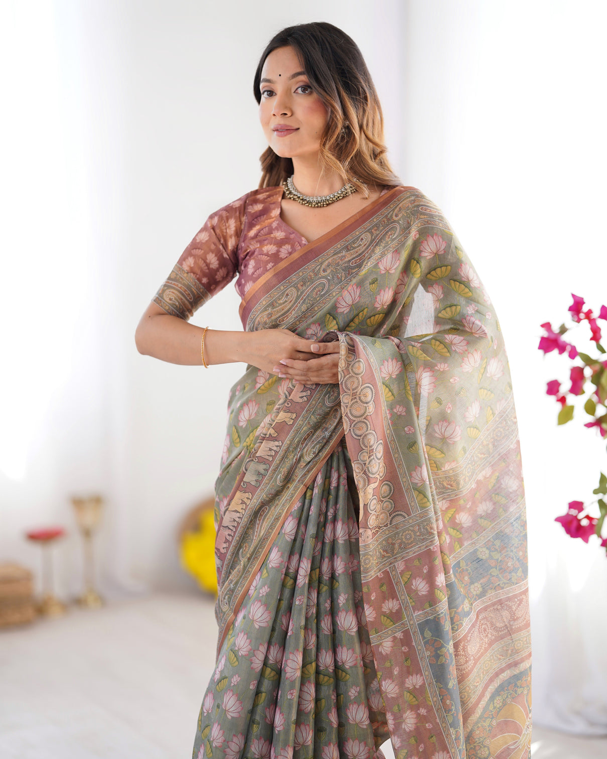 Olive green pure linen cotton handloom saree with pink lotus motifs maroon blouse