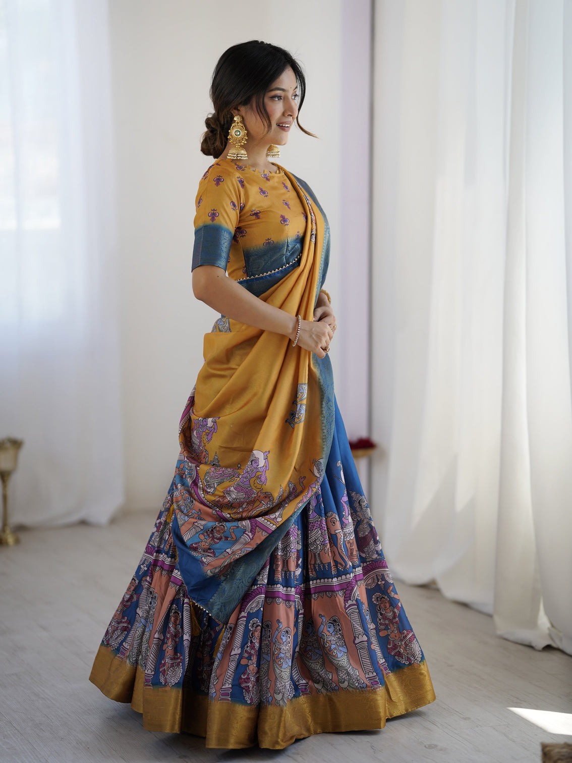 Elegant kalamkari lehenga in mustard and royal blue with flared skirt and dupatta