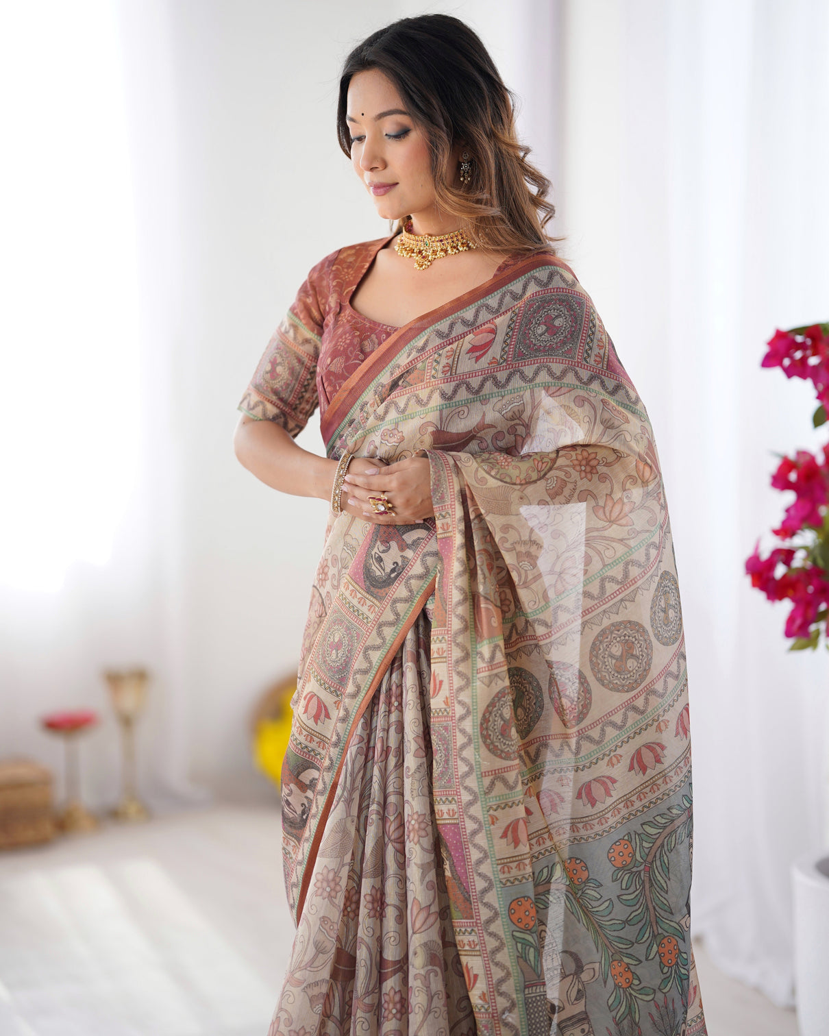 Beige maroon handloom cotton saree with royal faces elephant pallu motif
