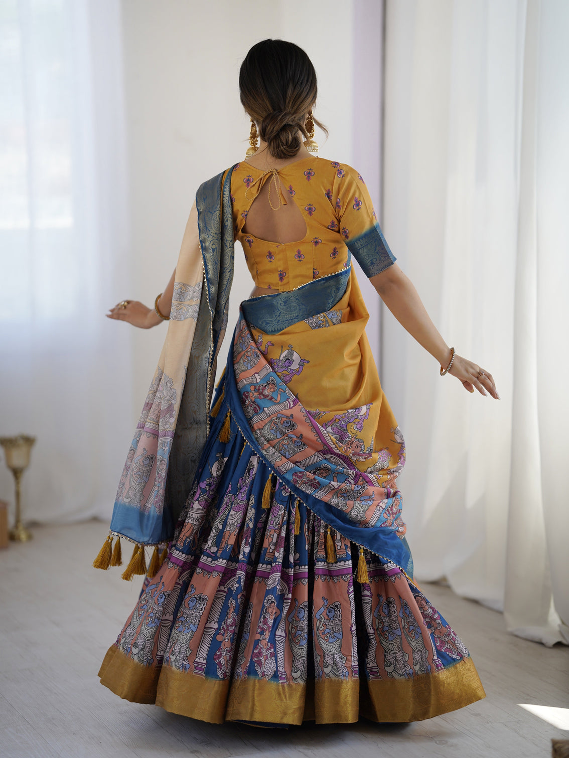 Elegant kalamkari lehenga in mustard and royal blue with flared skirt and dupatta