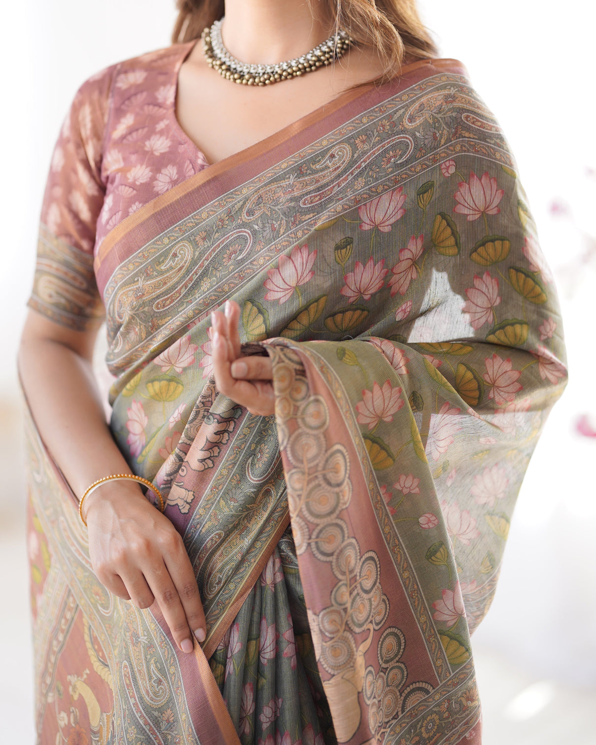 Olive green pure linen cotton handloom saree with pink lotus motifs maroon blouse