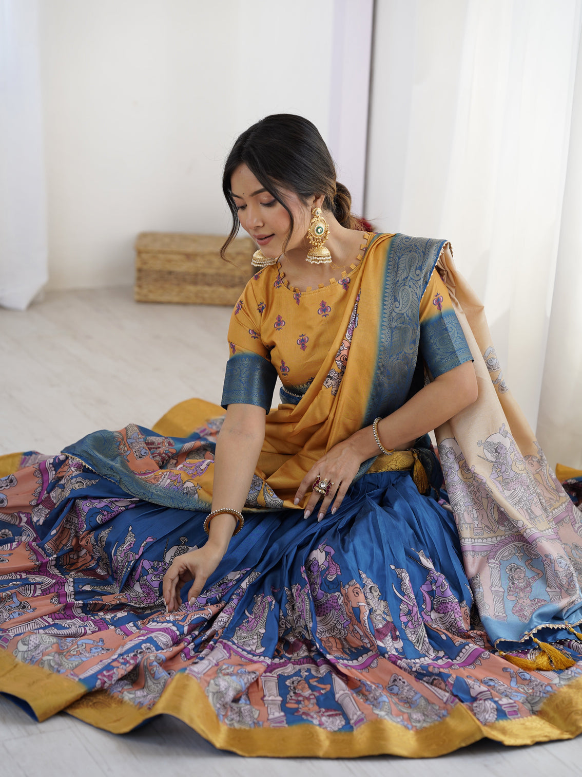 Elegant kalamkari lehenga in mustard and royal blue with flared skirt and dupatta