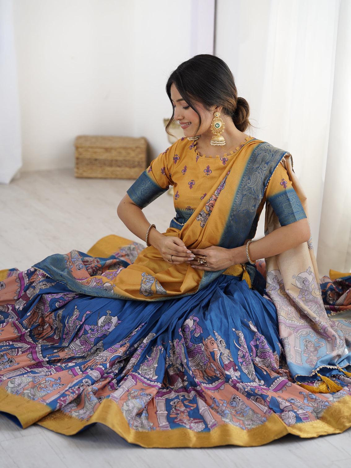 Elegant kalamkari lehenga in mustard and royal blue with flared skirt and dupatta