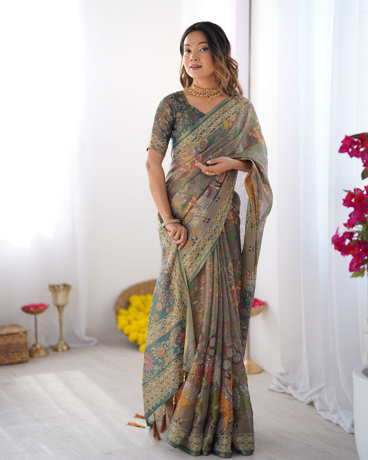 Teal green handloom cotton saree with floral print and royal elephant pallu mameraa