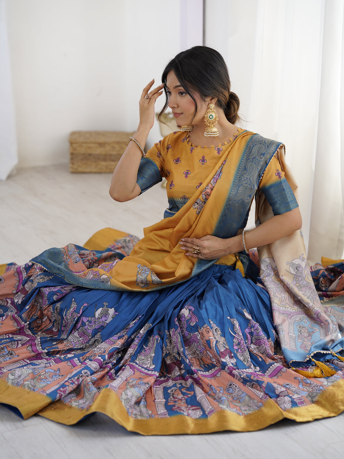 Elegant kalamkari lehenga in mustard and royal blue with flared skirt and dupatta