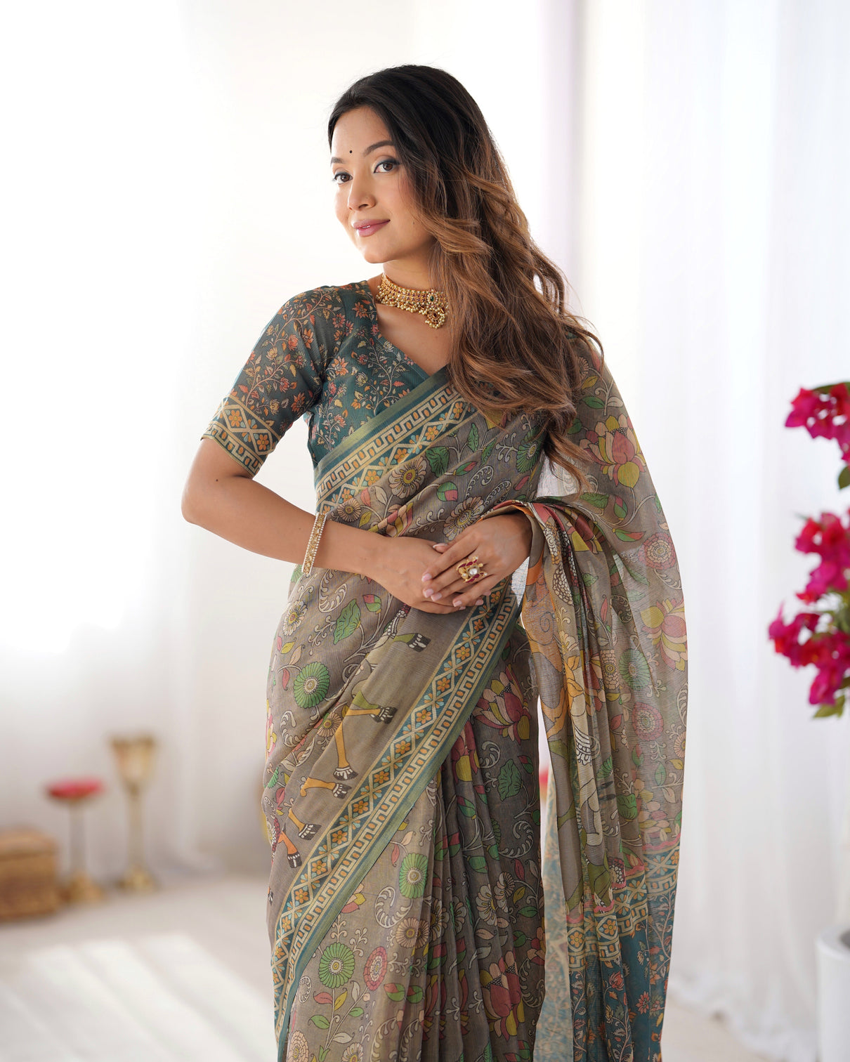 Teal green handloom cotton saree with floral print and royal elephant pallu