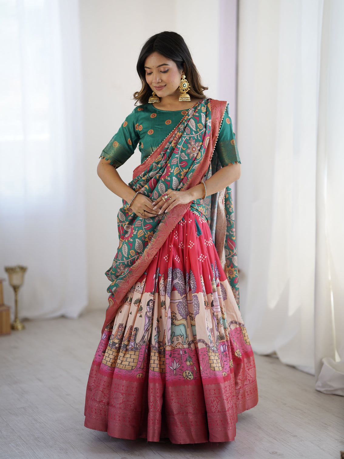 Elegant kalamkari lehenga in rani pink and teal green with mythological print and floral dupatta