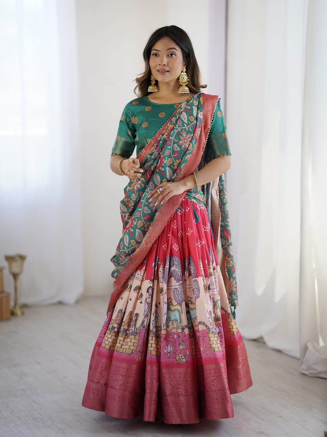 Elegant kalamkari lehenga in rani pink and teal green with mythological print and floral dupatta mameraa