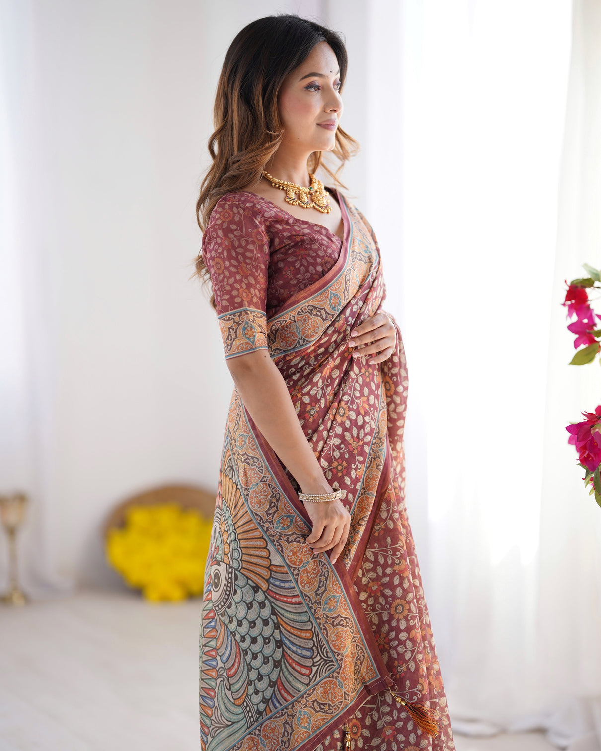 Maroon pure linen cotton handloom saree with floral buti print and madhubani fish art pallu