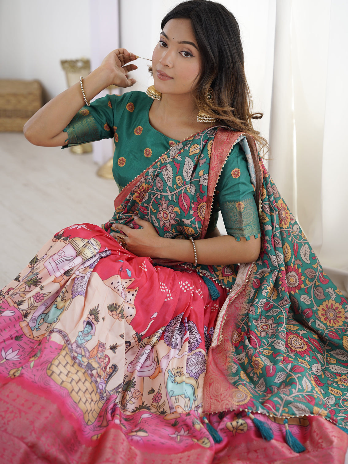 Elegant kalamkari lehenga in rani pink and teal green with mythological print and floral dupatta