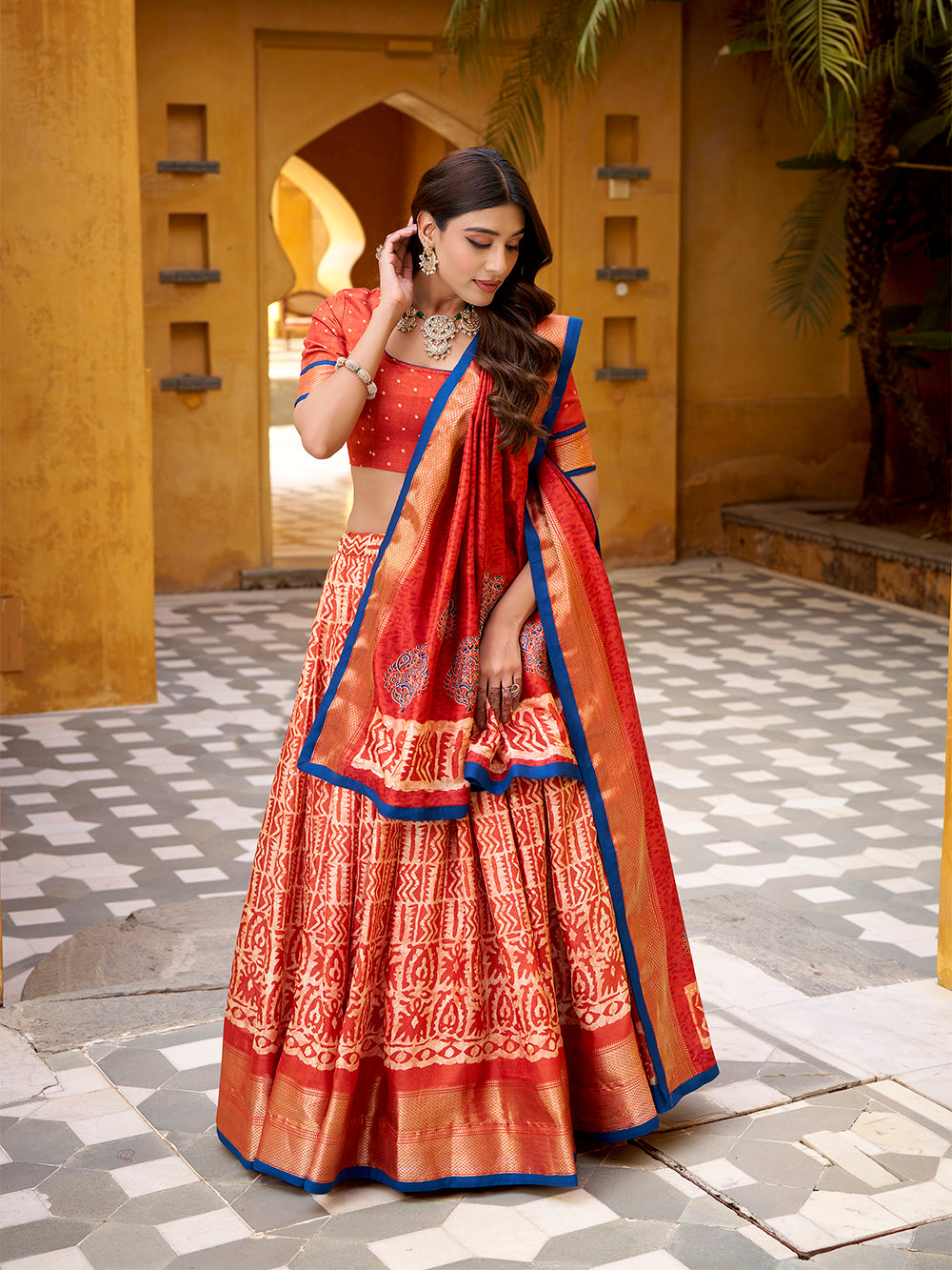 Rust orange color batik printed dola silk lehenga