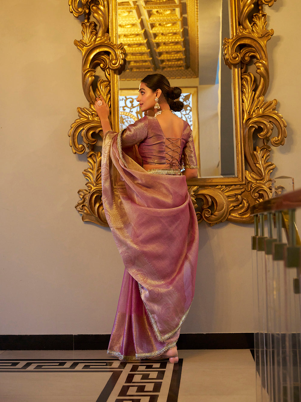 Light pink zari weaving tissue shimmer saree with sequins lace border