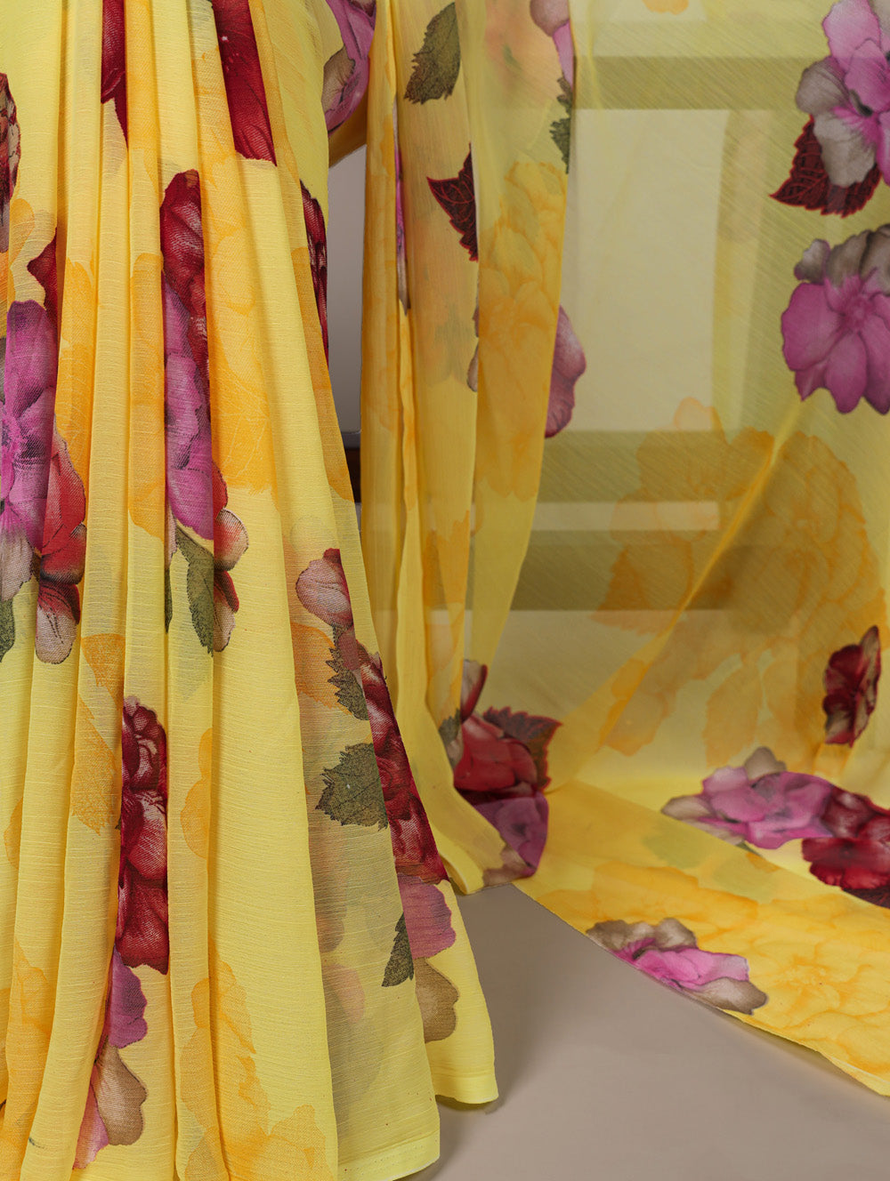 Yellow floral print chiffon saree with red banglory blouse lace border