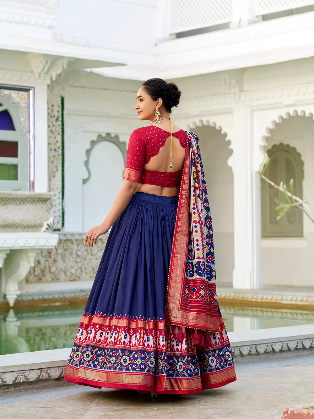 Navy blue tasar silk lehenga choli with ikkat patola print foil work