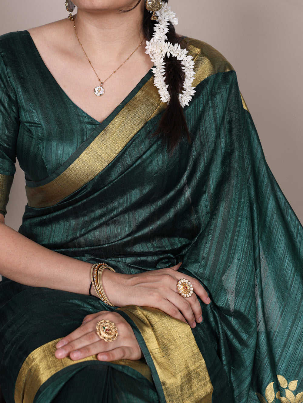 Green raw silk saree with intricate zari weaving unstitched blouse