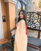 Gold Organza Saree with Sequins Red Corset Blouse for Grand Celebrations
