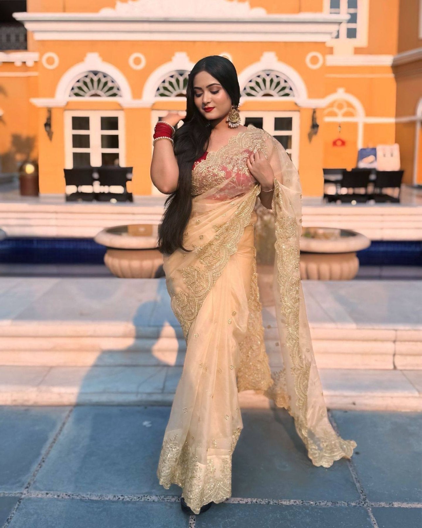 Gold Organza Saree with Sequins Red Corset Blouse for Grand Celebrations
